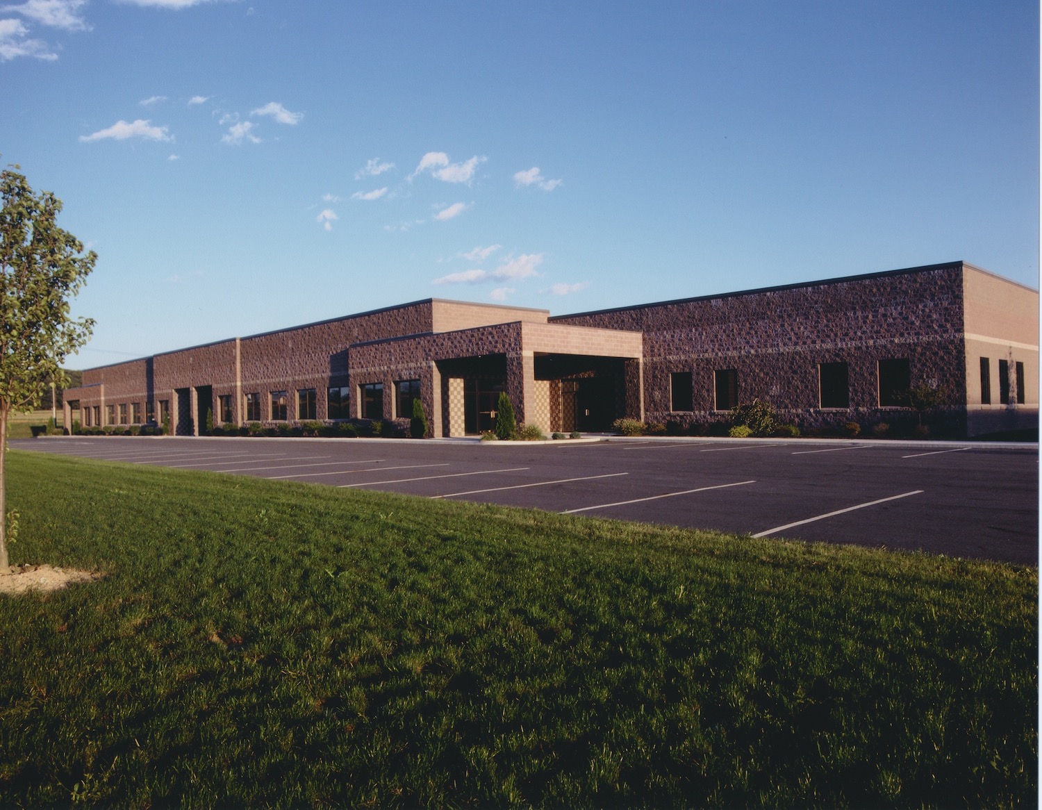 Front of industrial building and parking lot in Morgantown, Pennsylvania.